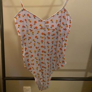 Blue floral bodysuit.